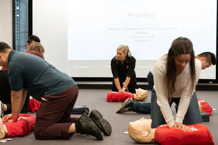 Group first–aid class at a workplace